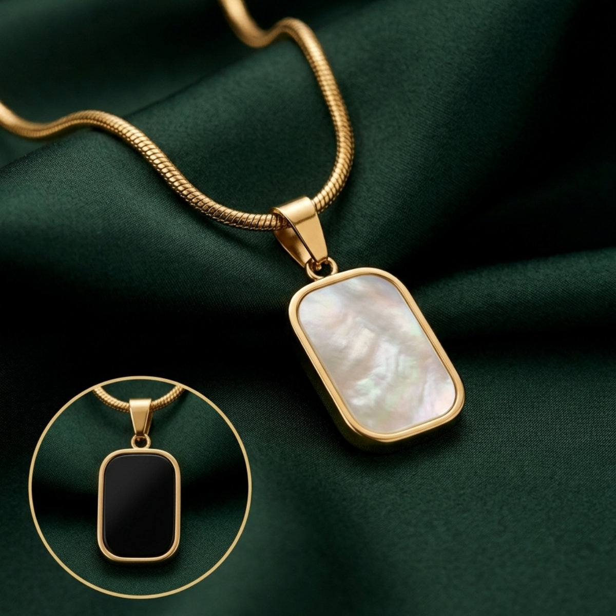 18kt gold plated reversible day and night pendant necklace lying on green fabric.