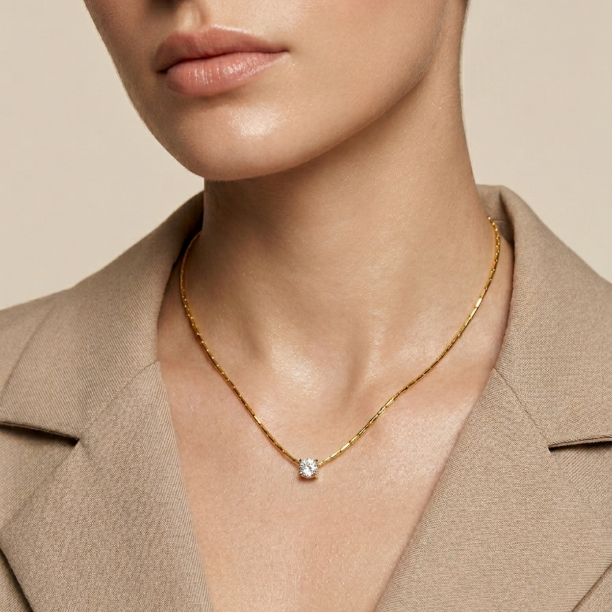 Close-up of a person wearing a gold necklace with a diamond pendant against a beige background