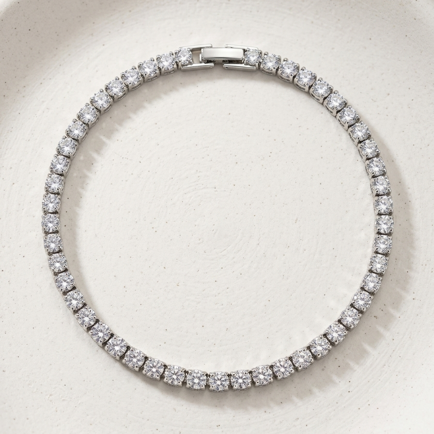 premium silver-tone rhodium plated tennis bracelet featuring a continuous row of sparkling CZ diamonds and a secure box clasp.