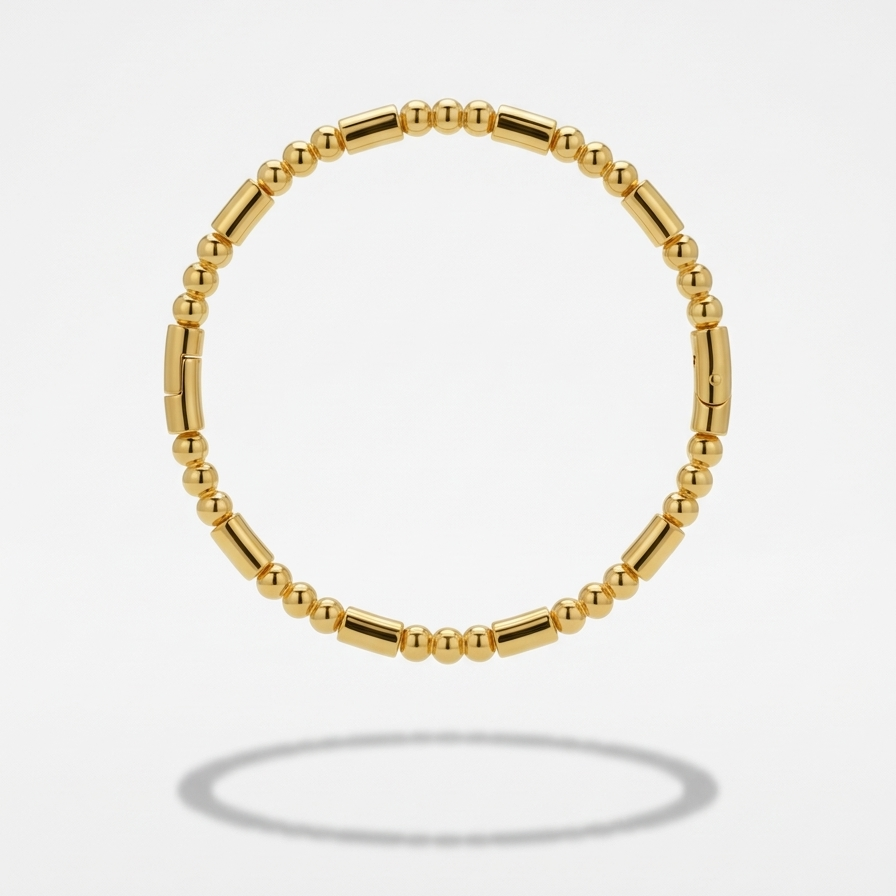 18k gold plated bracelet featuring a minimalist pattern of alternating polished gold spheres and sleek cylinder links.