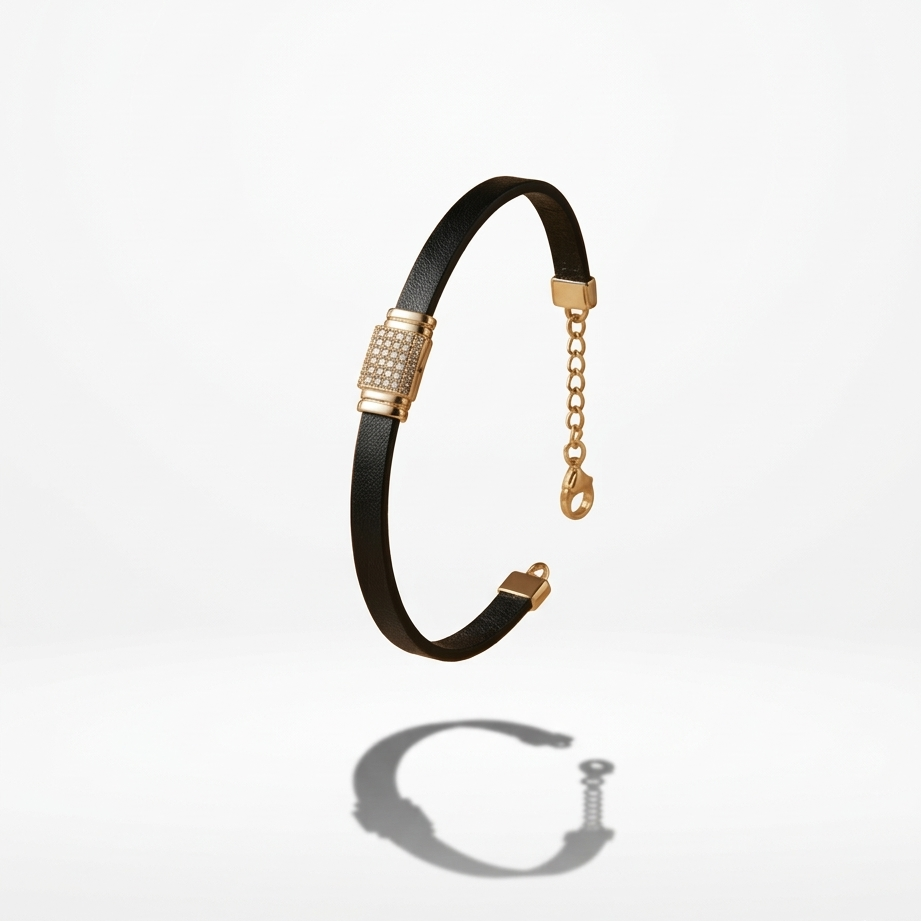 A sporty black ribbed bracelet featuring a bold, rectangular 18k gold plated clasp covered in pave CZ diamonds.