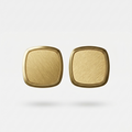 Pair of 18kt gold plated square-shaped earrings on a light beige background