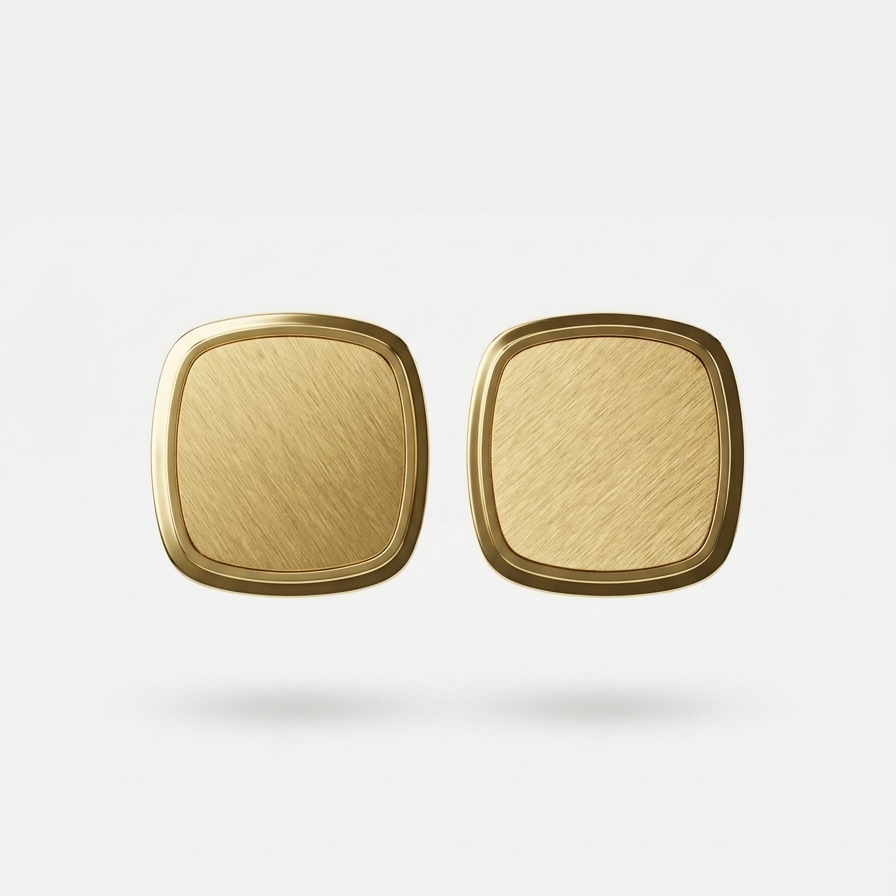 Pair of 18kt gold plated square-shaped earrings on a light beige background