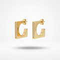 18kt gold plated hoops with small crystals on a light gray background.