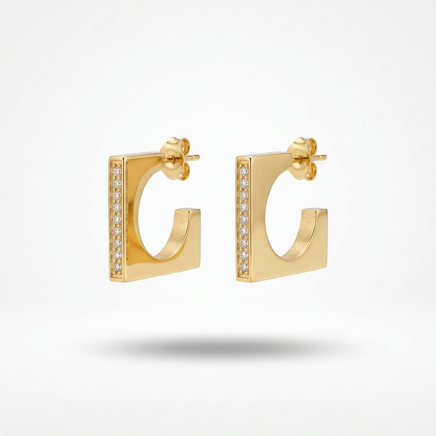 18kt gold plated hoops with small crystals on a light gray background.
