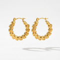 Close up of 18k gold plated hoop earrings with an intricate braided vine and leaf texture, floating in with white background.