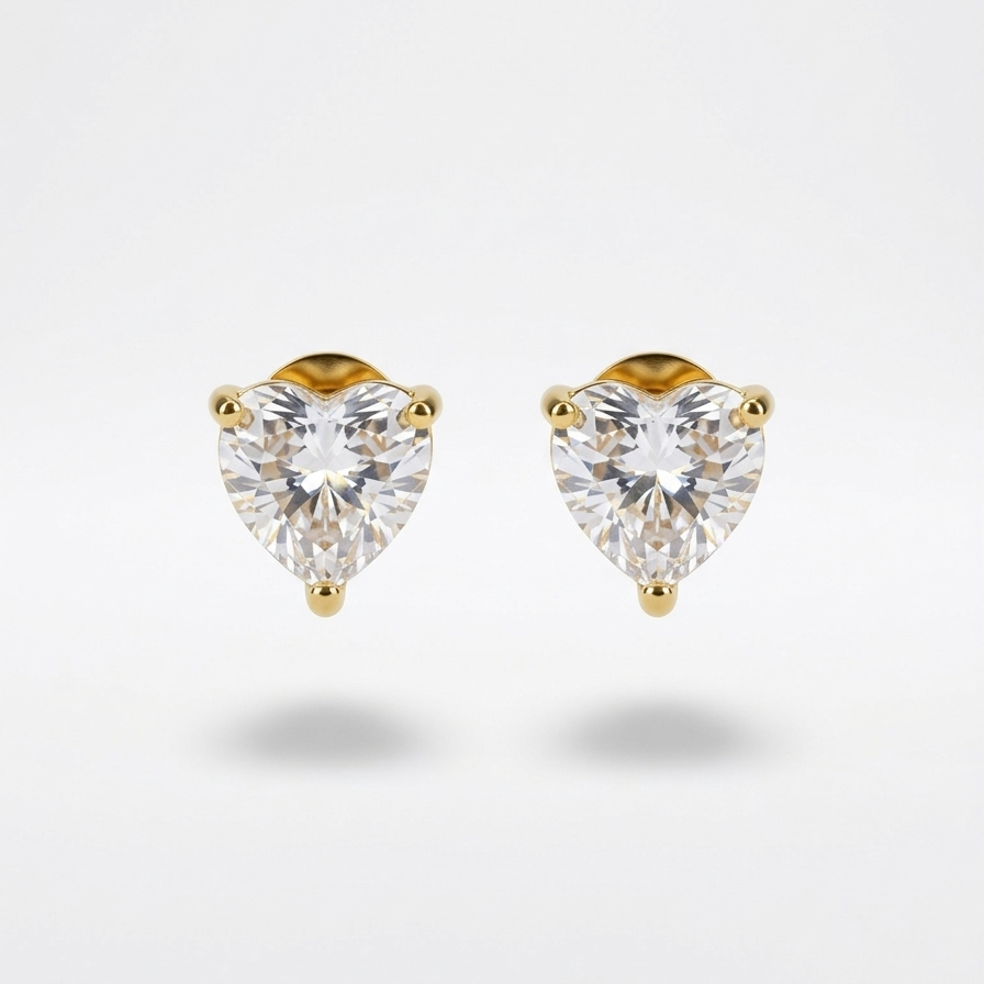 18k gold plated stud earrings featuring a clear, sparkling heart-shaped diamond on light grey background.
