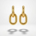 Pair of 18k gold plated drop earrings featuring two thick, interlocking oval chain links. on a light gray background