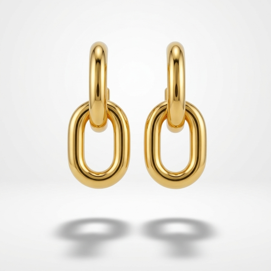 Pair of 18k gold plated drop earrings featuring two thick, interlocking oval chain links. on a light gray background
