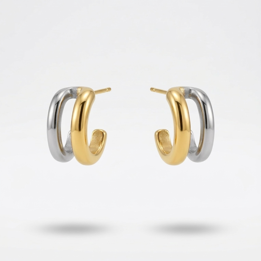 double hoop earrings, featuring one gold band and one silver band intertwined.