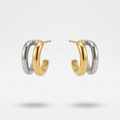 double hoop earrings, featuring one gold band and one silver band intertwined.
