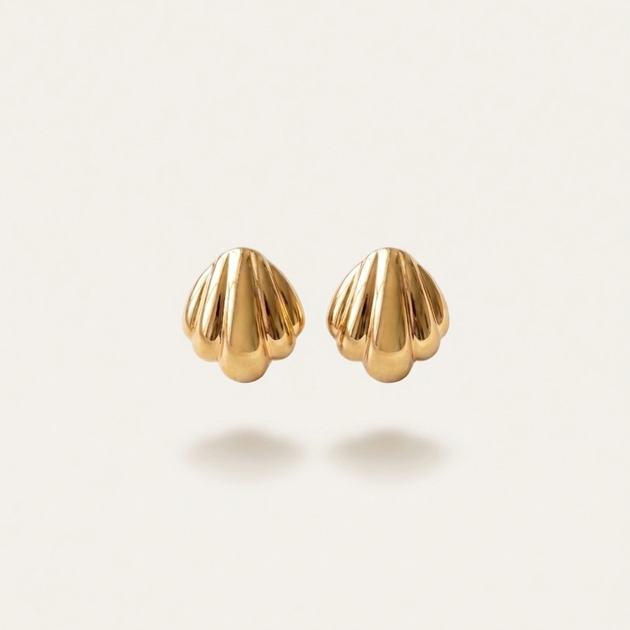 18k gold plated stud earrings shaped like polished minimalist scallop seashells.
