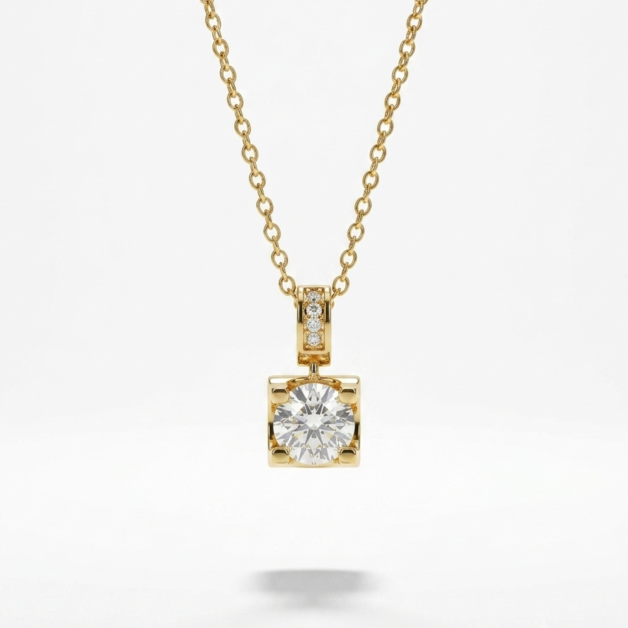 A yellow gold necklace with a delicate chain and a square pendant featuring a round clear gemstone surrounded by small side stones, shown on a light gray background.