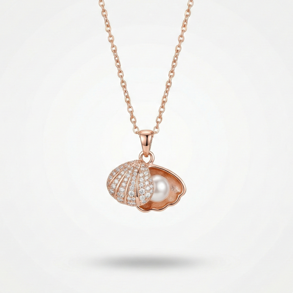 Rose gold necklace with a shell and pearl pendant on a light gray background