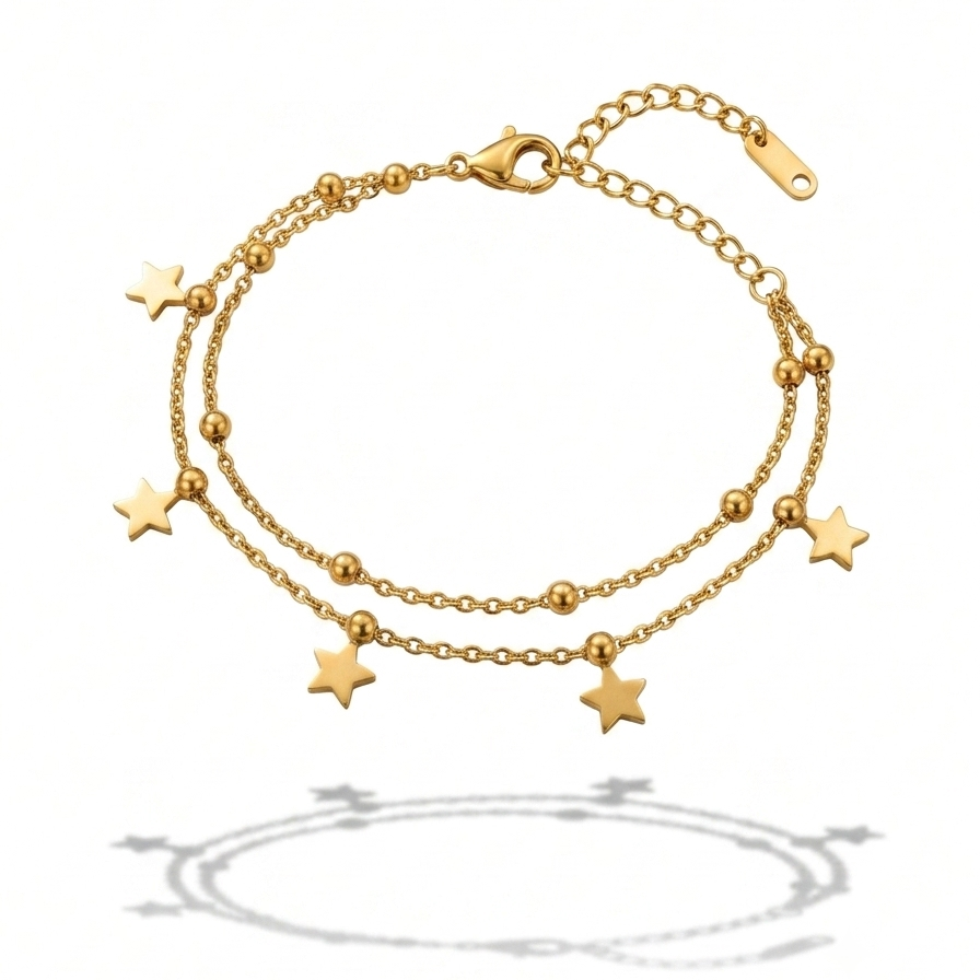 A gold double-strand chain anklet decorated with five star charms and small bead accents, displayed on a clean white background with a soft shadow below.
