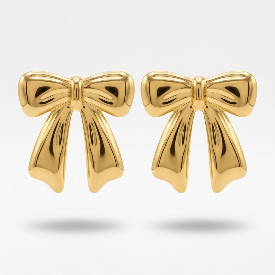 18kt gold plated bow-shaped studs floating on a light gray background.