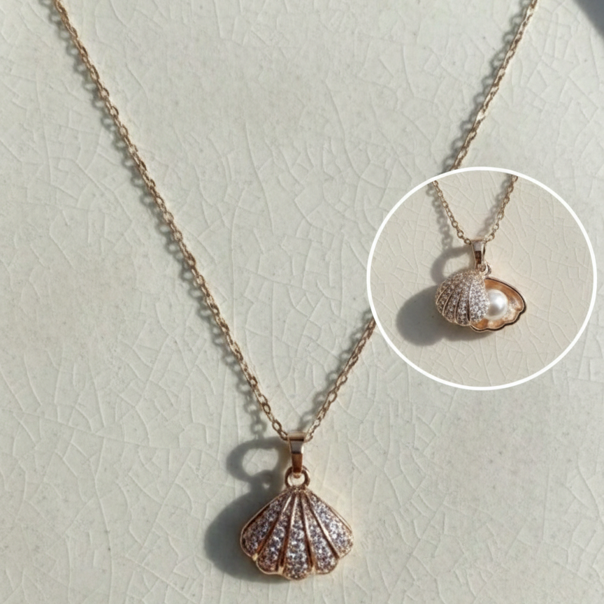 Rose gold shell pendant necklace on a light gray background