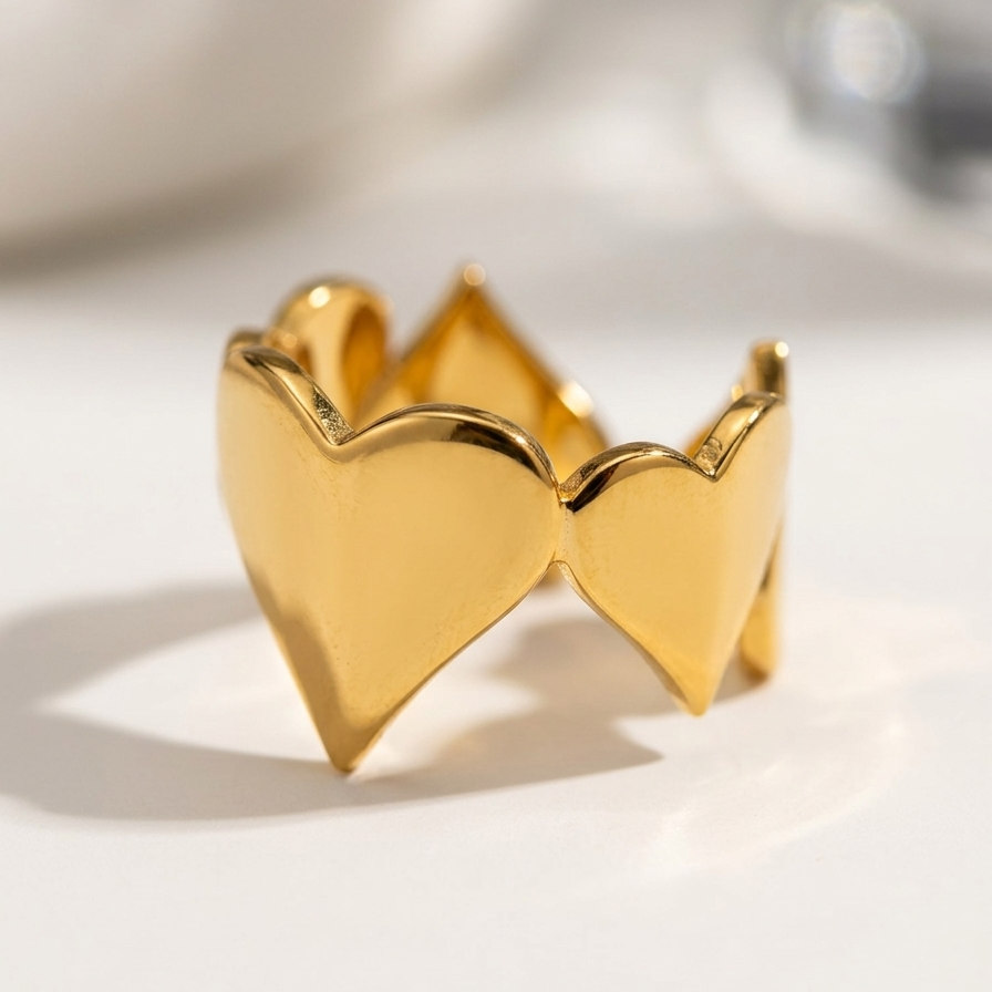18kt gold plated heart-shaped earring on a white background