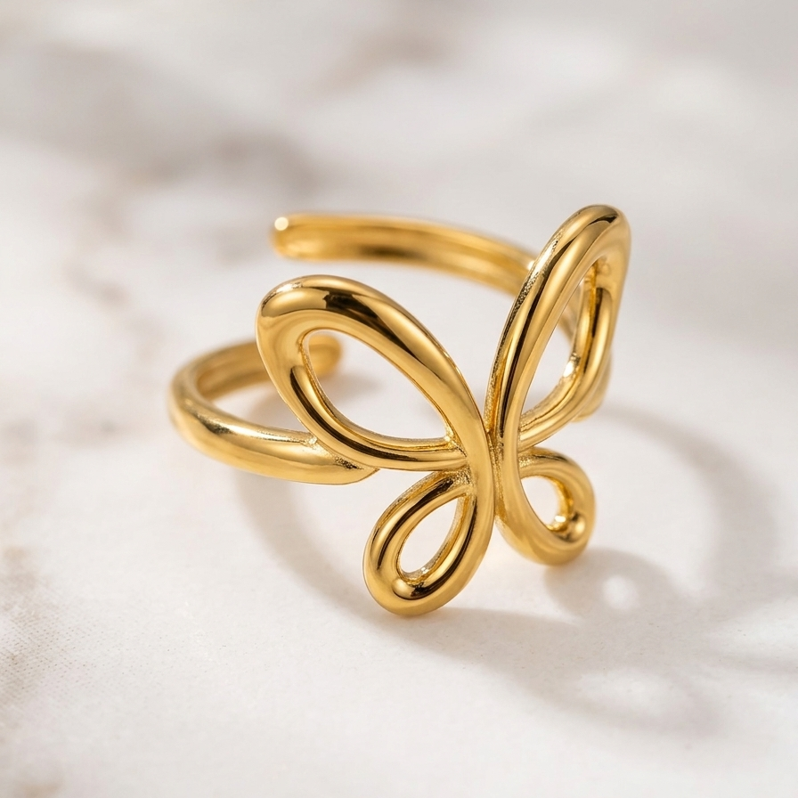 18kt gold plated butterfly-shaped ring on a light background