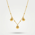 18kt gold plated shell charm necklace with three scallop shells floating on a white background.