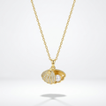 18kt gold plated hidden pearl shell necklace floating on a white background.