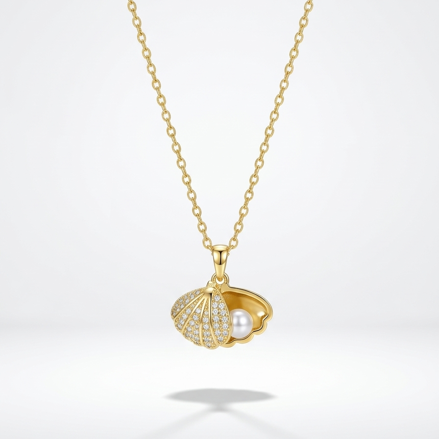 18kt gold plated hidden pearl shell necklace floating on a white background.