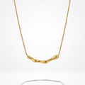 18kt gold plated bamboo bar necklace floating on a white background.