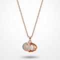 Rose gold necklace with a shell pendant featuring a pearl floating on a white background.