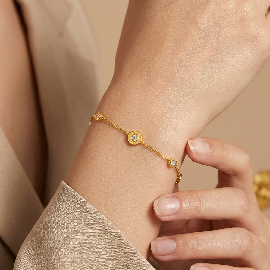 A woman model worn 18kt gold plated, waterproof roman numeral station bracelet on her wrist.