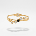 18kt gold plated, waterproof, the onyx crystal orbit bangle bracelet floating on white background.