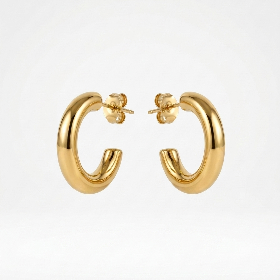 18kt gold plated everyday tube hoops floating on a white background.