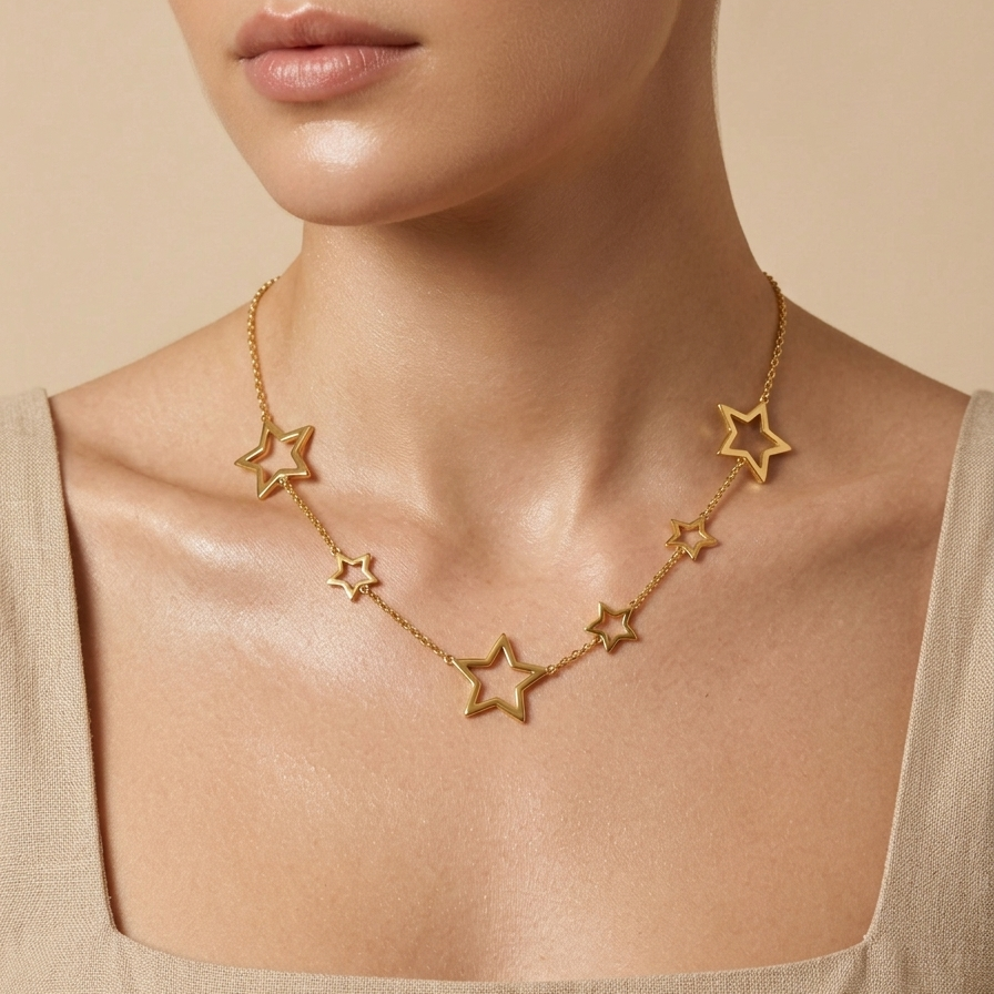 A model wear's 18kt gold plated celestial star station necklace.