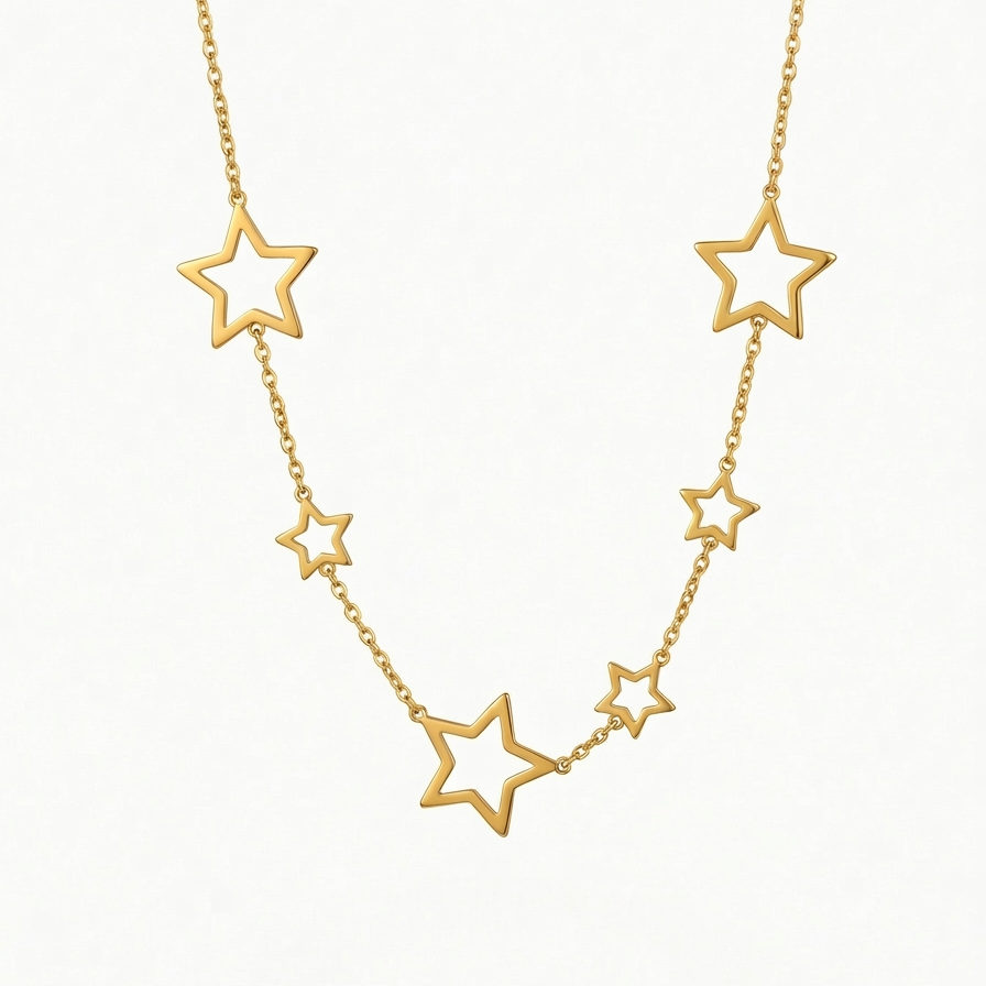 18kt gold plated celestial star station necklace floating on white background.
