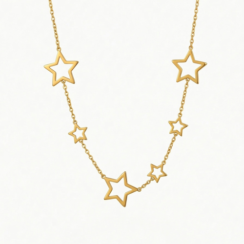18kt gold plated celestial star station necklace floating on white background.