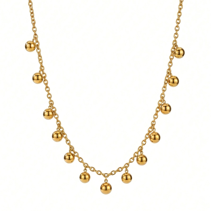 18kt gold plated necklace with spherical beads floating on a white background.
