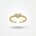 A gold open-bend ring featuring a small heart-shaped cluster of clear stones at the center, shown on a clean white background with a soft shadow.