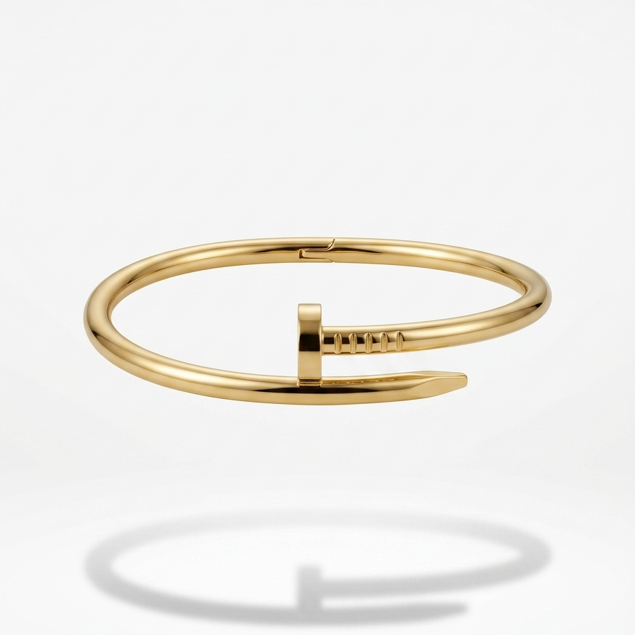 18kt gold plated nail bracelet floating on a white background.