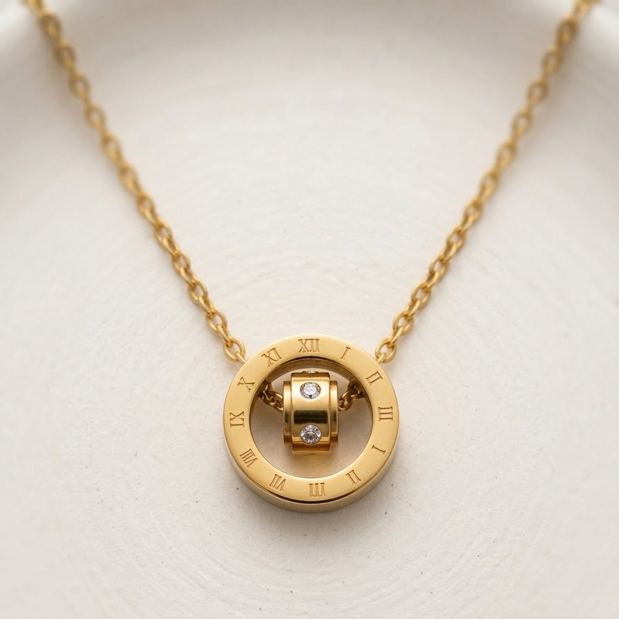 18k gold plated necklace featuring a circular pendant engraved with Roman numerals and a spinning inner barrel accented with CZ diamonds.