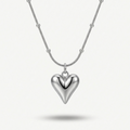 Silver-tone rhodium plated necklace featuring a smooth, 3D puffy heart pendant suspended on a delicate beaded satellite chain.