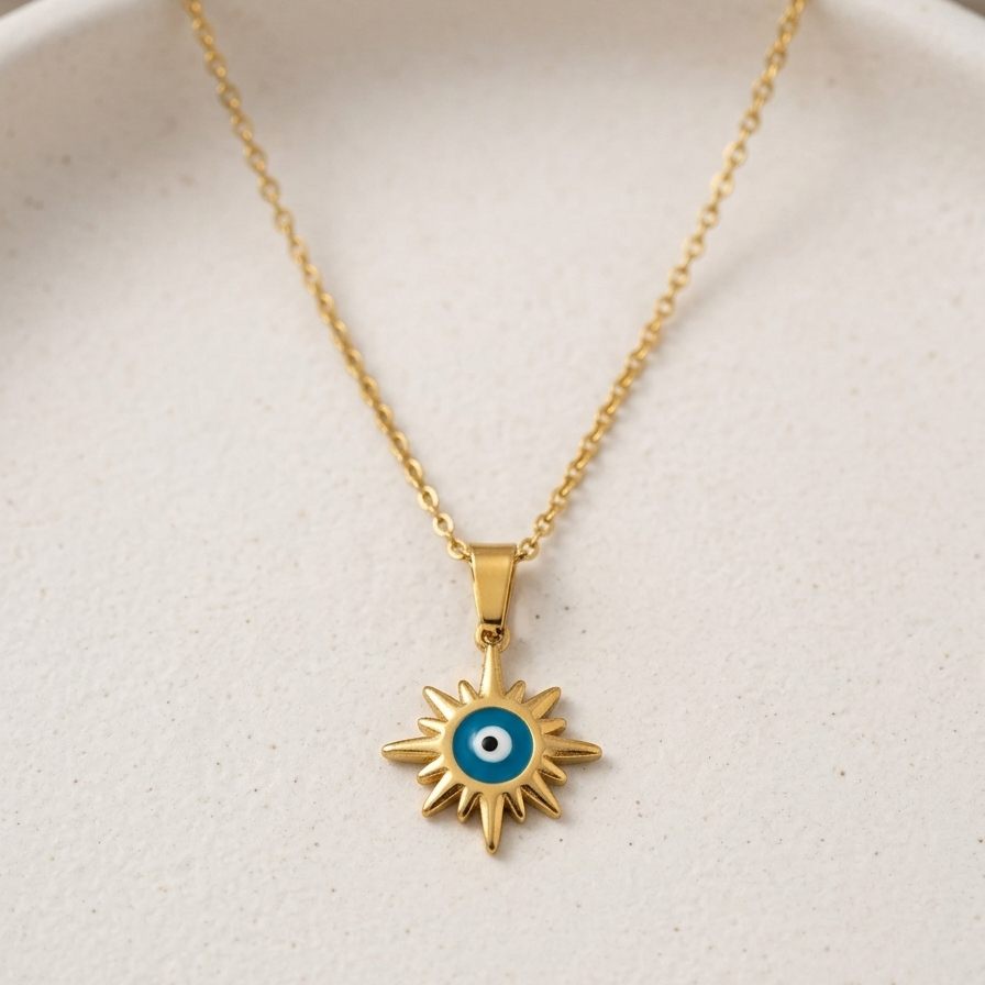 18k gold plated necklace featuring a radiant sunburst pendant with a classic blue and white enamel evil eye in the center.