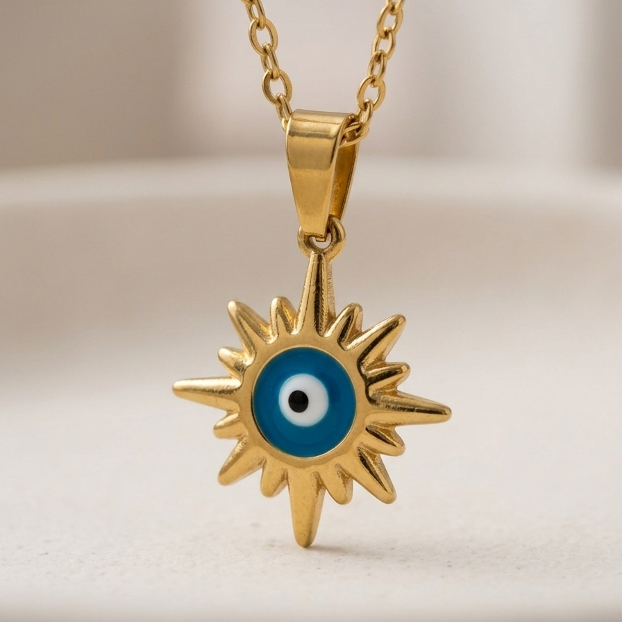 18k gold plated necklace featuring a radiant sunburst pendant with a classic blue and white enamel evil eye in the center.