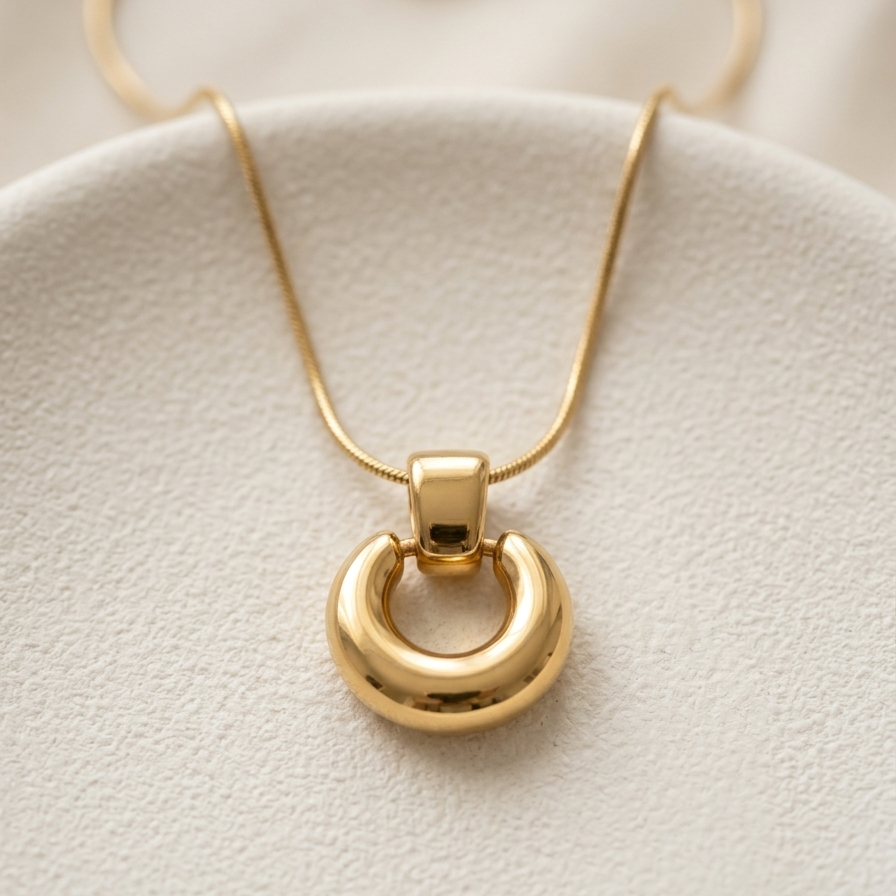 18k gold plated necklace featuring a thick, chunky donut-shaped hoop pendant suspended on a sleek snake chain.