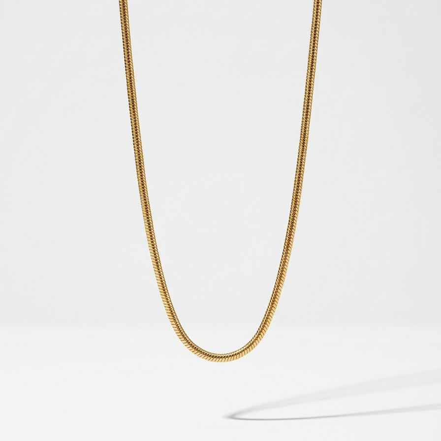 18k gold plated foxtail layering chain showing intricate woven V-shaped links and an adjustable extender clasp.