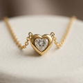 Delicate 18k gold plated necklace featuring a very small, smooth heart-shaped pendant with a sparkling clear CZ diamond center.