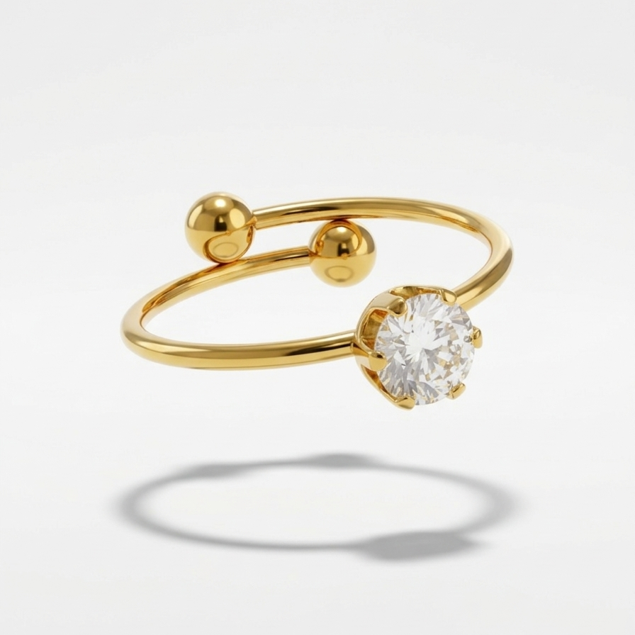 an 18k gold plated minimalist adjustable ring featuring a single CZ diamond and two small gold spheres.