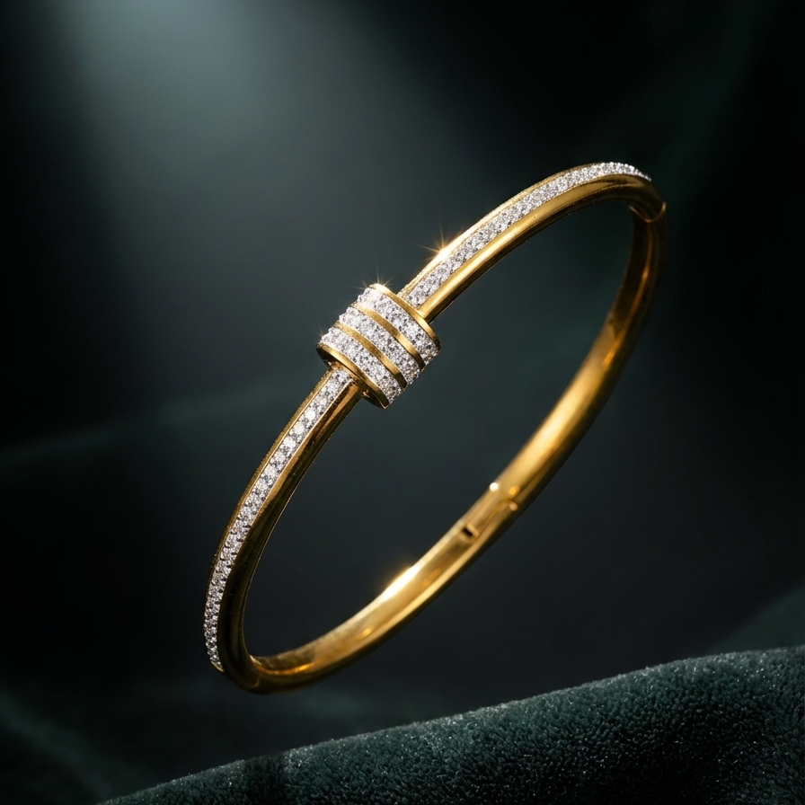 Gold bangle bracelet with triple row crystal center station on textured surface.