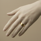 Gold heart shaped ring with crown details on beige background.